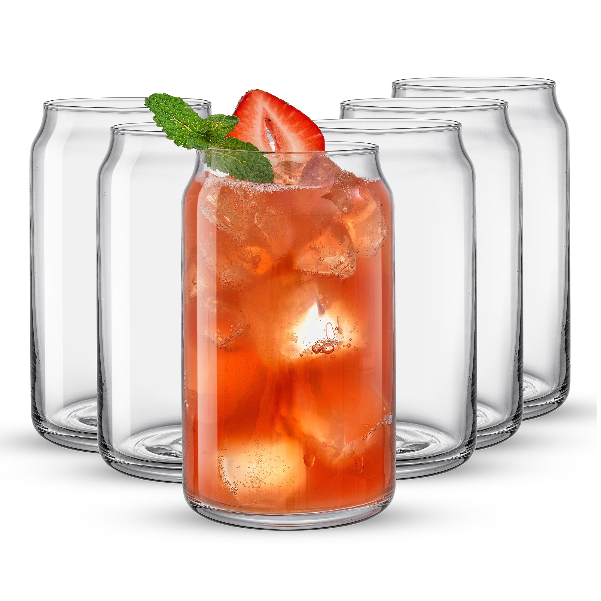 Five clear glass cups and one glass cup filled with a red beverage, mint leaf, and strawberry shaped like classic beverage cans sit in a row on a white background. These are JoyJolt Classic Can Shape Tumbler Drinking Glass Cups.