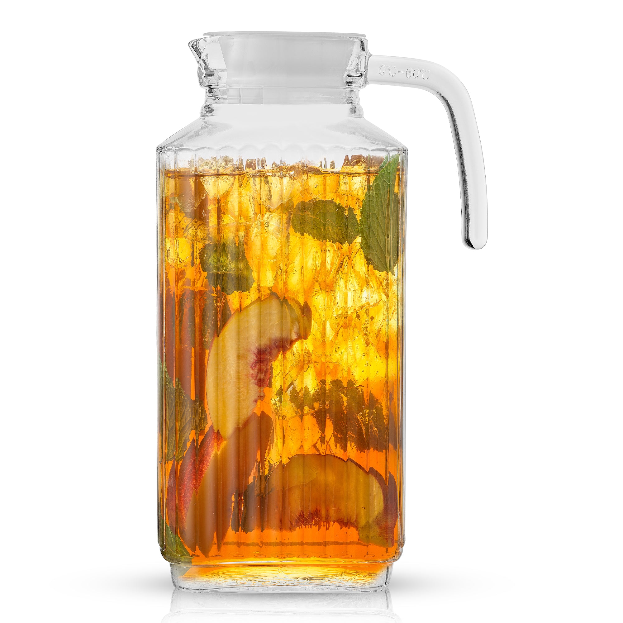 A 60-ounce JoyJolt Beverage Serveware Glass Pitcher filled with iced tea, peaches, and mint leaves sits on a white background. The pitcher has a clear handle and spout for pouring. Ice cubes float in the tea.