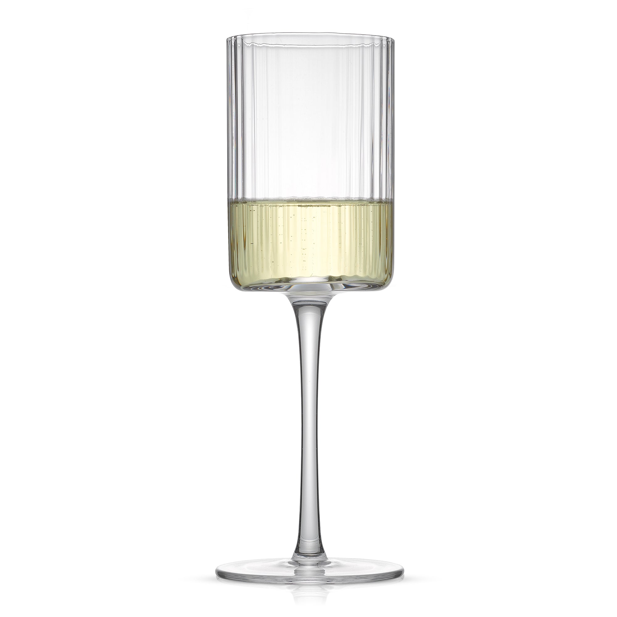 A single tall, stemmed fluted wine glass. The glass contains white wine.