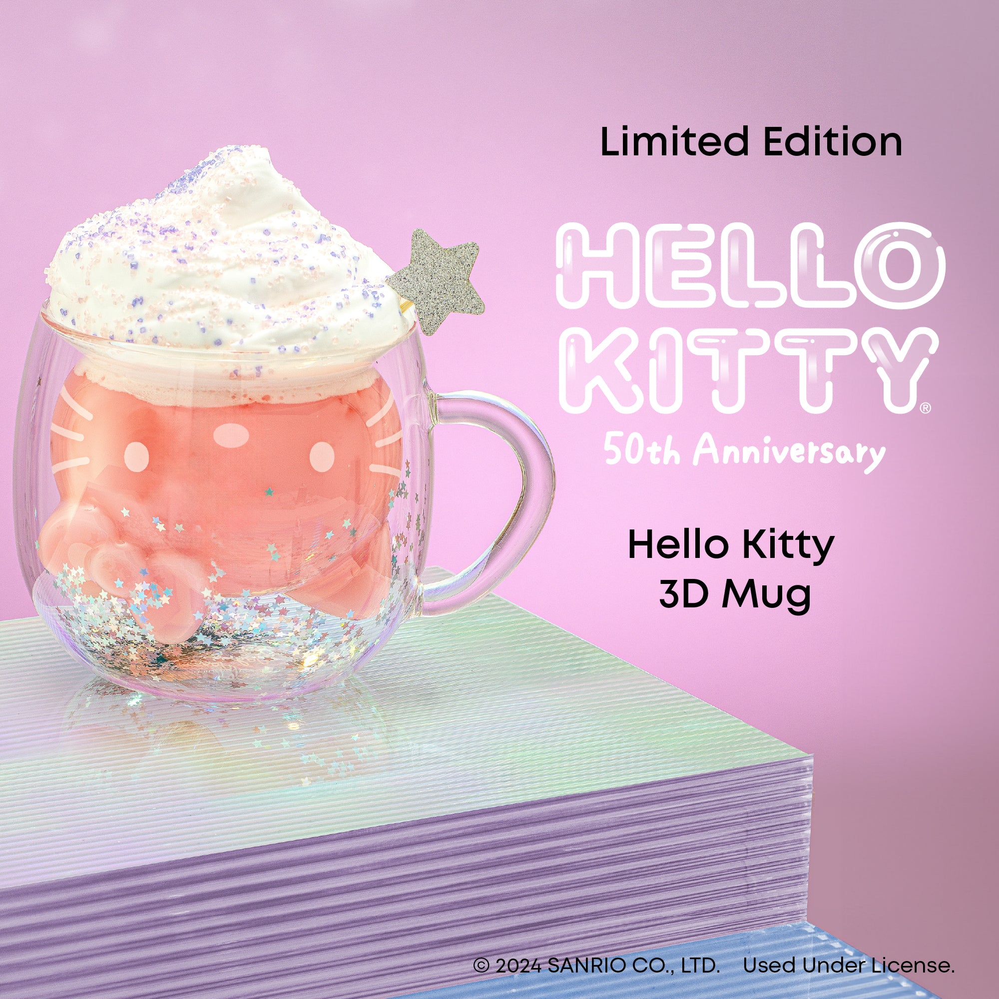 A limited edition Hello Kitty 3D mug. The mug is pink and features a Hello Kitty design on the outside. There is a 3D Hello Kitty figure inside the mug.