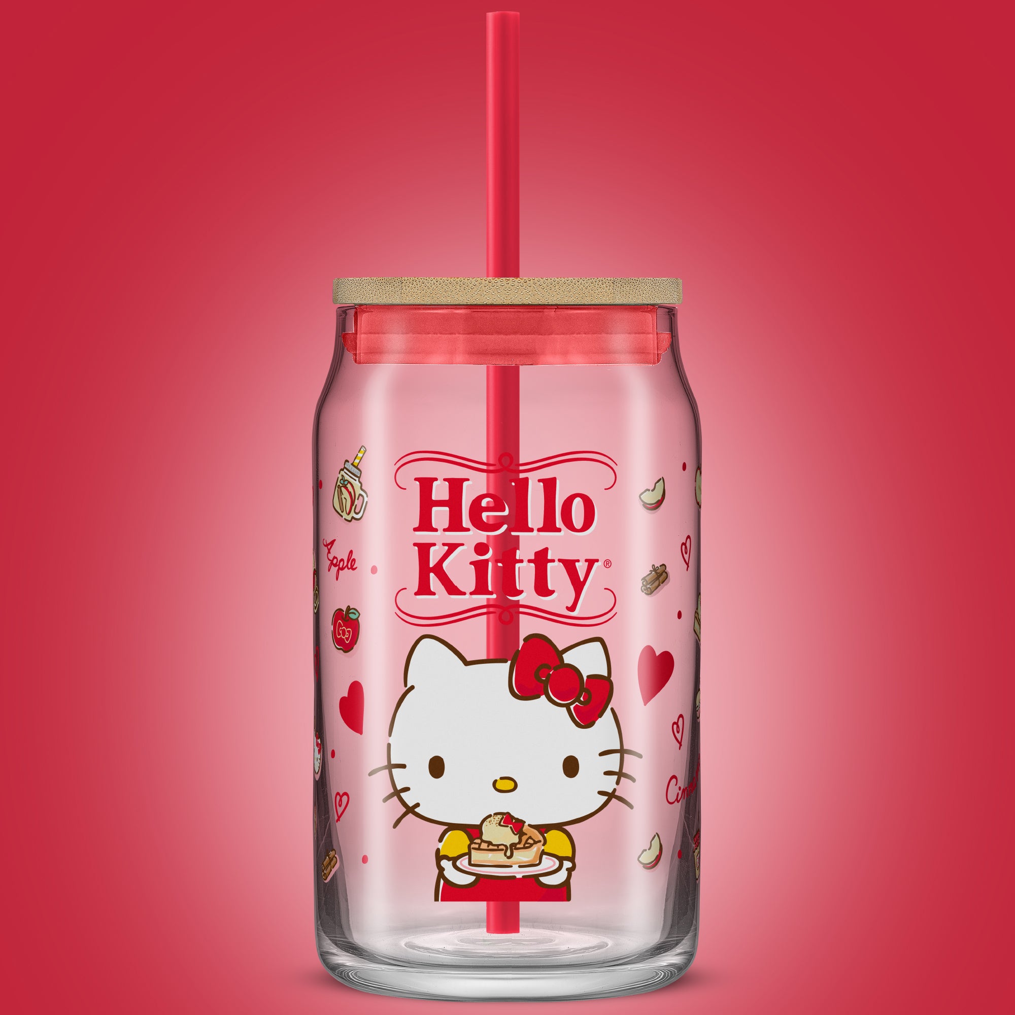 A JoyJolt x Hello Kitty tumbler glass with a bamboo lid and red straw. 