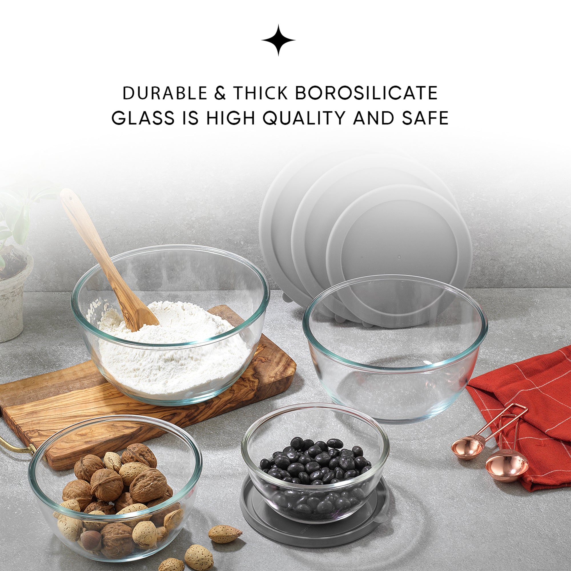 Four glass bowls filled with nuts and flour sit on a table. The bowls have gray lids next to them. Text on the image reads: "DURABLE & THICK BOROSILICATE GLASS IS HIGH QUALITY AND SAFE."